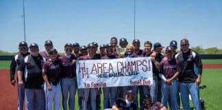 A baseball team crowd posing with a banner that reads 'We are champions' on a sunny field, celebrating a win with a trophy.